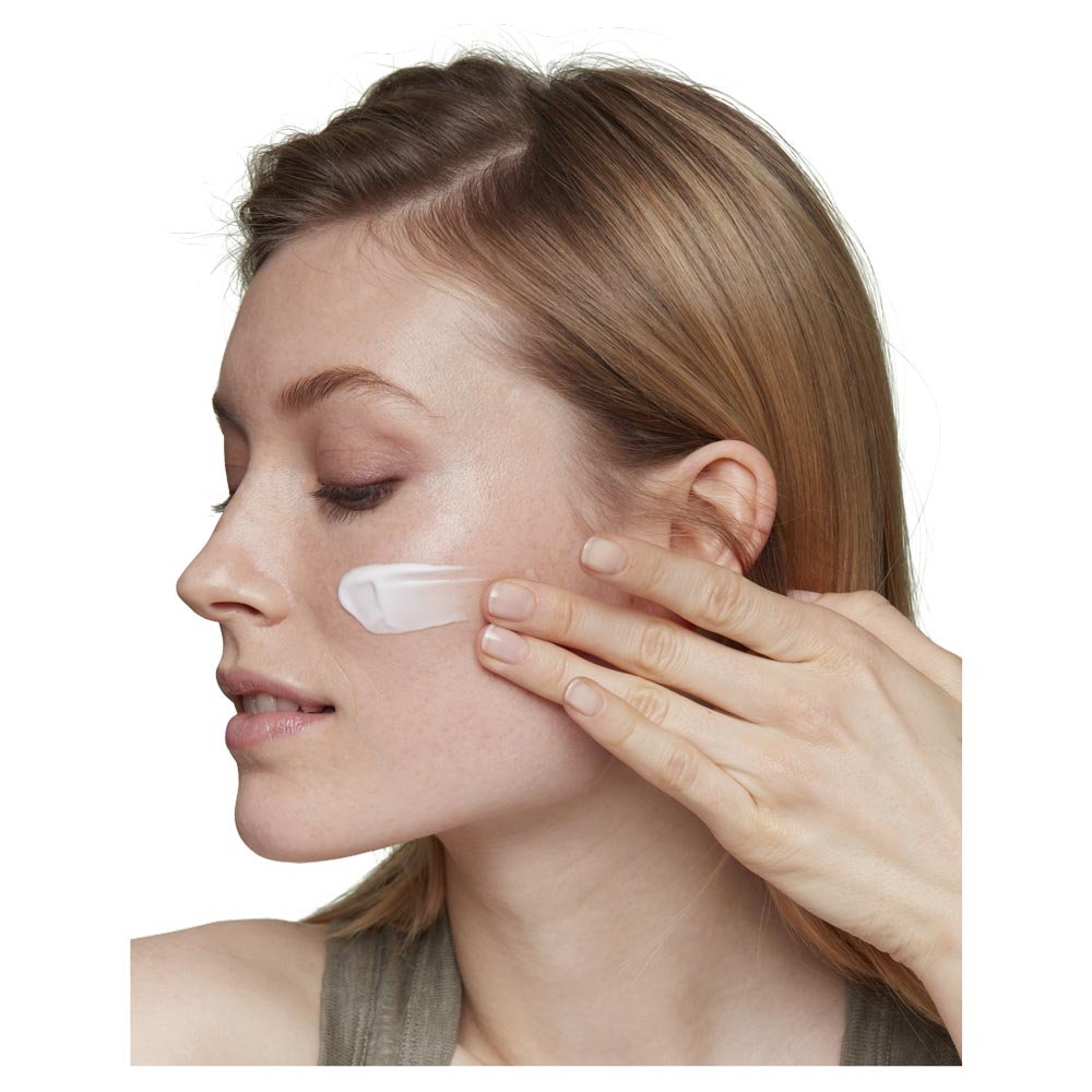 Garnier Organics Argan Nourishing Moisturiser texture shown on womans face